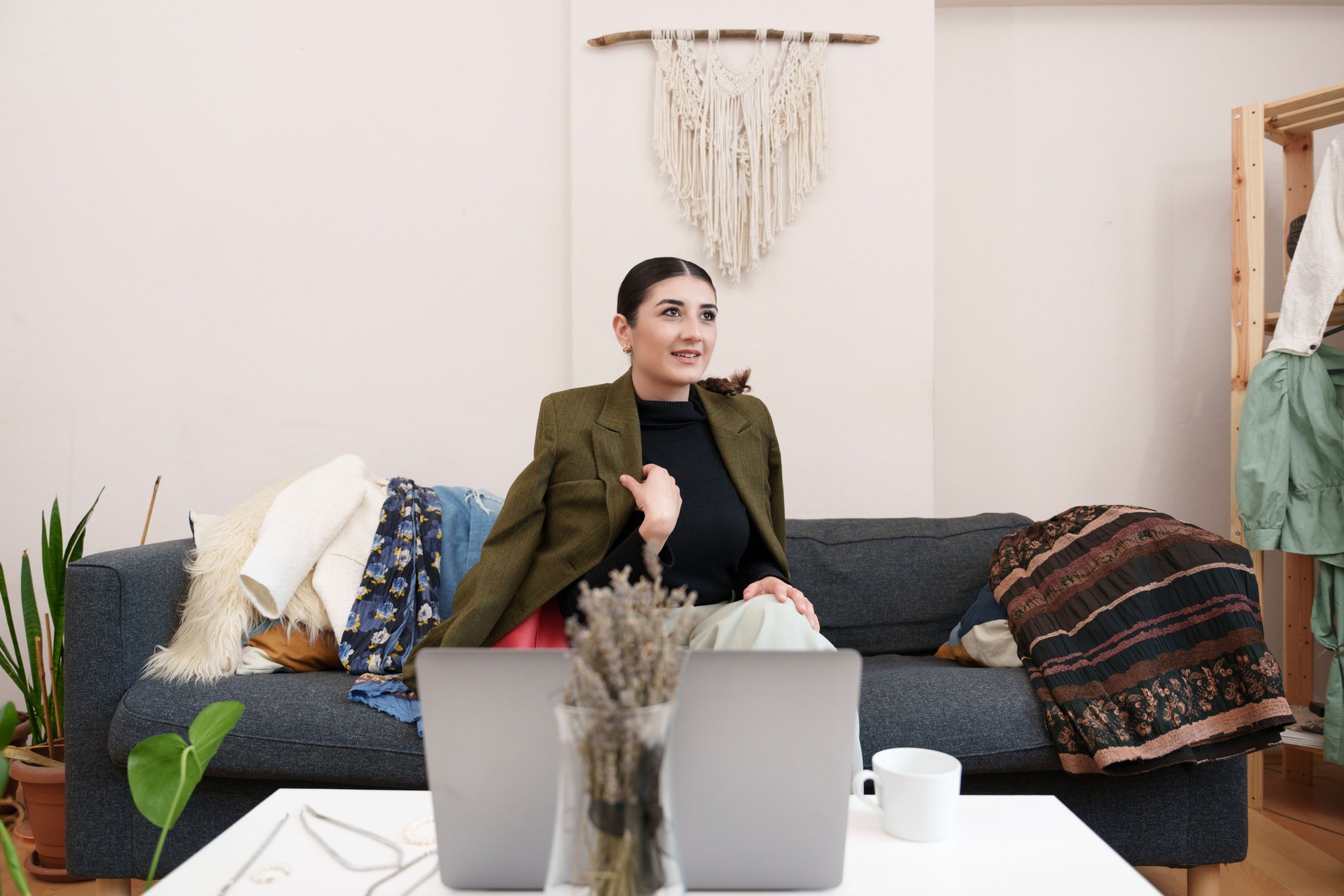 young women who meet with the online style consultant via laptop, determine their clothes, jewelry and accessories with the style consultant